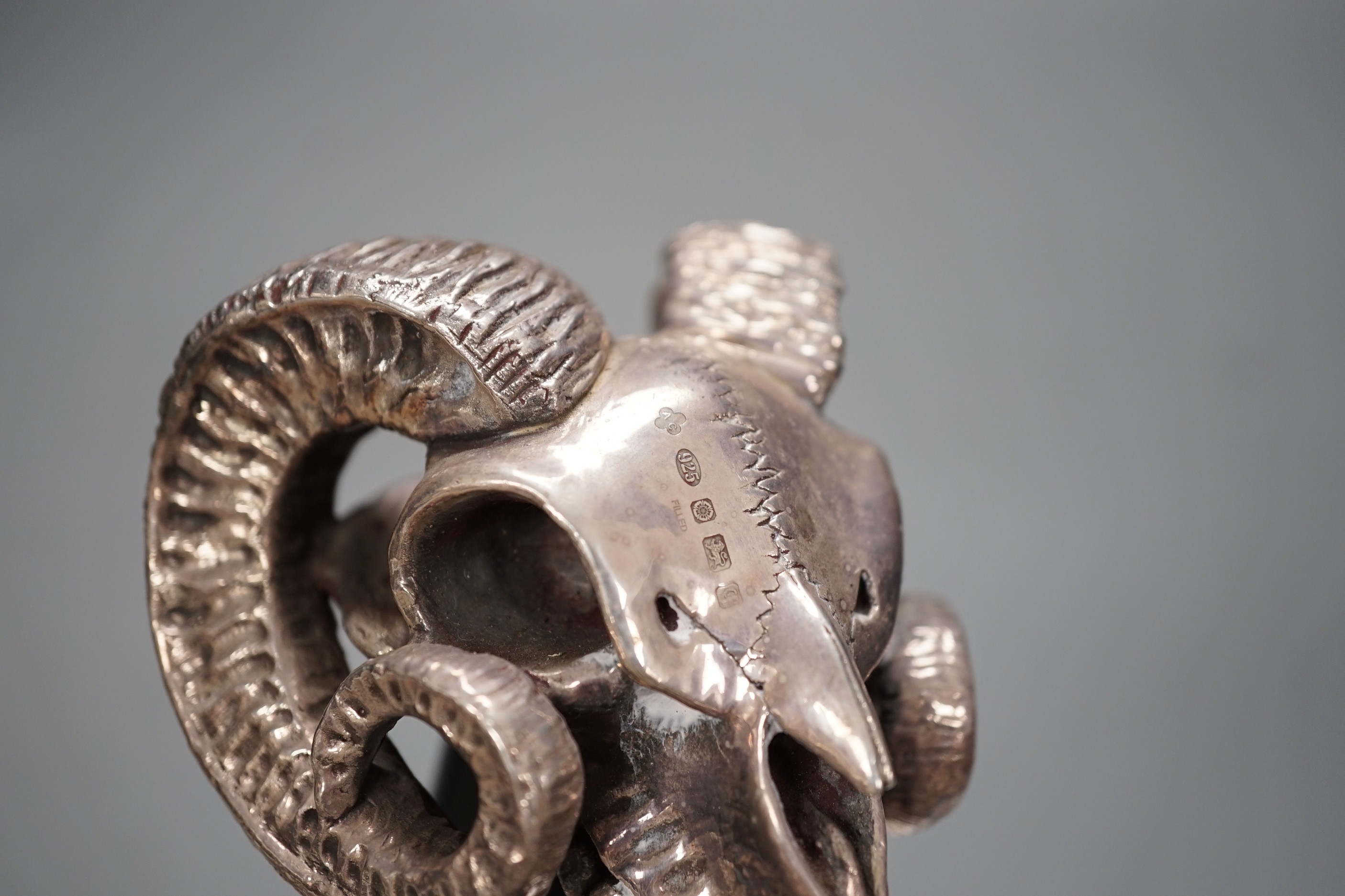 A Jeffery West umbrella with modern filled silver ram skull handle